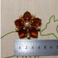 Pretty vintage costume brooch with light brown and pearl-like detail