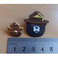 Pair of vintage Smokey Bear US lapel pin badges