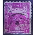 Pakistan 1957 R10 strip of 3 + single used 13 1/2 perf