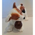 Delightful Royal Doulton puppy playing with a ball in its mouth, practically mint, no damages!