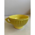 Large, bright yellow `The Conran Shop` bowl/cup