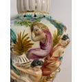#52 Tall Capodimonte vase/urn with handpainted figures in relief - damaged