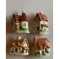 #86 Set of four ceramic cottages with magnets at the back