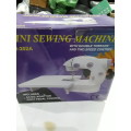 MINI SEWING MACHINE WITH DOUBLE THREADS AND 2 SPEED CONTROL WITH TABLE EXTENSION