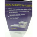 MINI SEWING MACHINE WITH DOUBLE THREADS AND 2 SPEED CONTROL WITH TABLE EXTENSION