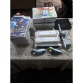 NINTENDO WII CONSOLE INCLUDING REMOTE,POWER SUPPLY, 20 GAME DISCS AND ALL ASSESCORIES (WORKS)