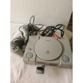 SONY PLAYSTATION 1 WITH 2 REMOTES,POWER SUPPLY AND AV CABLE (ONE GAME DISC INCLUDED)