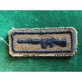 SADF PERIOD MARKSMAN BADGE EMBROIDERED IN BLACK THREAD ON NUTRIA BACKING
