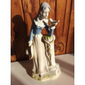 Lady with Bird Glazed Porcelain Figurine