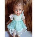 Old Vinyl Plastic Doll with Blue Eyes That Open and Close