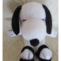 A CUTE SMALL SNOOPY IN SANDALS