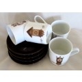 FOUR MITTERTEICH COFFEE CUPS AND SAUCERS - HOLLAND CLOCK DESIGN NO'S 1 TO 4