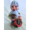 A VERY OLD 19CM TALL VINTAGE HARD RUBBER GNOME CARRYING A CORNUCOPIA OF MUSHROOMS!!