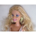 GLAMOROUS MATTEL BARBIE DOLL WITH KNEES THAT BEND AND WEARING ORIGINAL EARRINGS