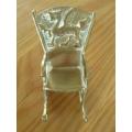SMALL ORNAMENTAL SOLID BRASS ROCKING CHAIR