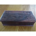 A VINTAGE INTRICATELY CARVED WOODEN BOX