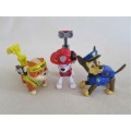 THREE CUTE SMALL HARD PLASTIC DOGS IN OUTFITS