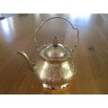 A DECORATIVE VINTAGE INDIAN BRASS TEAPOT - BEAUTIFULLY ETCHED WITH FLORAL DESIGN