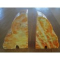 A PAIR OF HEAVY AMBER HONEY ONYX? BOOKENDS