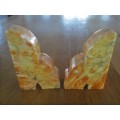 A PAIR OF HEAVY AMBER HONEY ONYX? BOOKENDS
