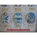 A VINTAGE BOXED FRAME DEPICTING VARIOUS FACIAL MASKS/CHARACTERS IN CHINESE OPERA