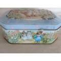 A COLLECTABLE BENTLEY'S OF LONDON TIN WITH RAISED RELIEF DESIGN - THE WORLD OF BEATRIX POTTER
