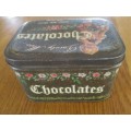 A VINTAGE "DAINTY MISS CHOCOLATES" TIN FILLED WITH OVER A HUNRED OLD 1/2 CENT COINS (LARGER SIZE)