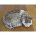A REALISTIC SLEEPING CAT MADE FROM ARTIFICIAL "FUR"
