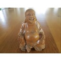 A NICE-SIZED CARVED WOODEN BUDDHA