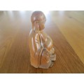 A NICE-SIZED CARVED WOODEN BUDDHA