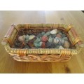 AN OLD BASKET FULL OF OVER EIGHTY ROUGH GEMSTONE ROCKS AND CRYSTALS
