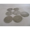A SET OF SEVEN ETCHED SILVER METAL COASTERS WITH STAND