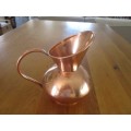 A LARGE VINTAGE SOLID COPPER JUG WITH LOADS OF CHARACTER AND MAKERS MARK ON BASE
