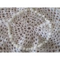 A PRETTY HAND CROCHETED DOILIE WITH PRETTY PINK AND WHITE PEARLESCENT BEADWORK