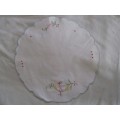 THREE DIFFERENT - SIZED ROUND EMBROIDERED CLOTHS WITH TULIP DESIGN AND SCALLOPED BORDERS
