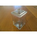 A HANDY SMALL GLASS CANNISTER WITH METAL LID
