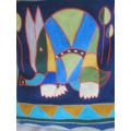 A COLOURFUL EMBROIDERED/WOVEN INDIAN CUSHION WITH ELEPHANT DESIGN