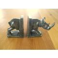 A PAIR OF HEAVY HAND CARVED STONE RHINO BOOK ENDS