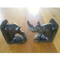 A PAIR OF HEAVY HAND CARVED STONE RHINO BOOK ENDS
