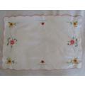 A PRETTY RECTANGULAR EMBROIDERED CLOTH WITH SCALLOPED EDGE