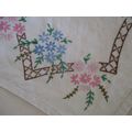 A PRETTY HAND EMBROIDERED RECTANGULAR CLOTH WITH SPRAYS OF PINK AND BLUE FLOWERS