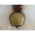 A HUGE VINTAGE BRASS SWISS COW BELL WITH STRAP AND LOVELY, DEEP RING