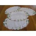 A set of 4 vintage oval hand embroidered and appliqued cloths with water lily design