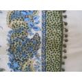 A pretty cloth with paisley and floral design and `bubble` tassels