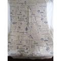 A very large, very long, wide table runner with South African scenes, songs and sayings