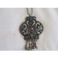 A very pretty Aztec design pendant and chain