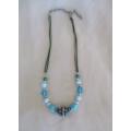 A very pretty necklace with blue beads