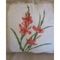 A large cushion with pretty day lilies