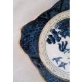 An unusual square blue and white willow pattern display plate with gold gilt detail