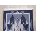 A lovely reversable rug with geometrical design